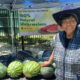 Agricultural Engineer Effie Gant displays watermelons from her Sacramento farm at the Temescal Festival in Oakland. Photo by Carla Thomas.