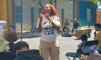 Khariyyah Shabazz, associate director of Neighborhood Development with Roots Community Health, addresses community members about Peace Committees at Lodestar Academy in East Oakland. Photo By Carla Thomas.