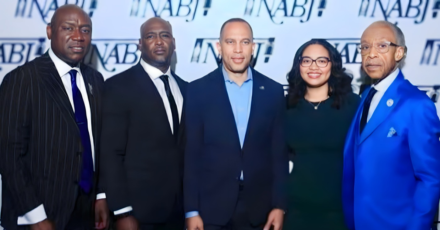 Civil Rights Attorney Ben Crump (left), House Majority Leader Hakeem Jeffries (middle), Rev. Al Sharpton (right) stand at the NABJ conference in Atlanta on Aug. 13 with Elmore and Christine Wonsley, the parents of Nolan Wells, a Black 18-year-old who died July 4th weekend in Mississippi