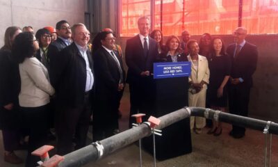 California Governor Gavin Newsom stands with public officials after signing Assembly Bill 179 in Oakland, Calif., on July 13 2026. Assembly Bill 179 modernizes how California finances and delivers affordable housing. (Lloyd B Davis/Bay City News)