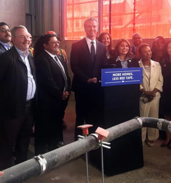 California Governor Gavin Newsom stands with public officials after signing Assembly Bill 179 in Oakland, Calif., on July 13 2026. Assembly Bill 179 modernizes how California finances and delivers affordable housing. (Lloyd B Davis/Bay City News)