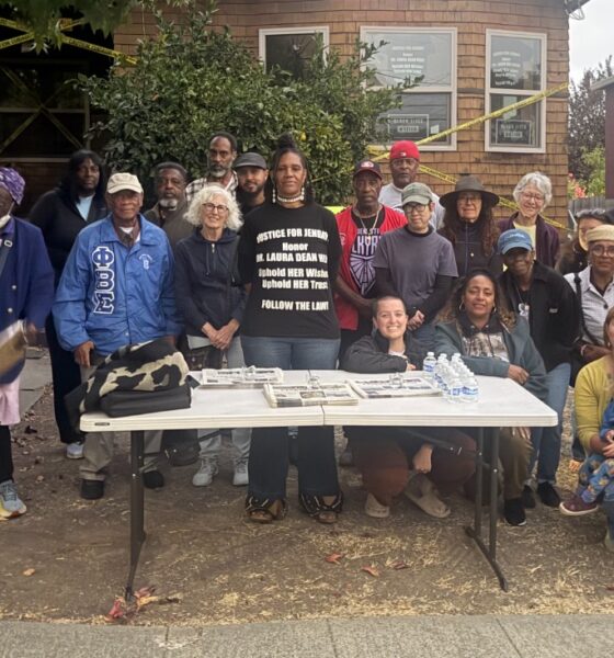 Zakiya Jendayi, center, surrounded by supporters at the weekly gathering at her house to halt her eviction. Photo by Tanya Dennis.
