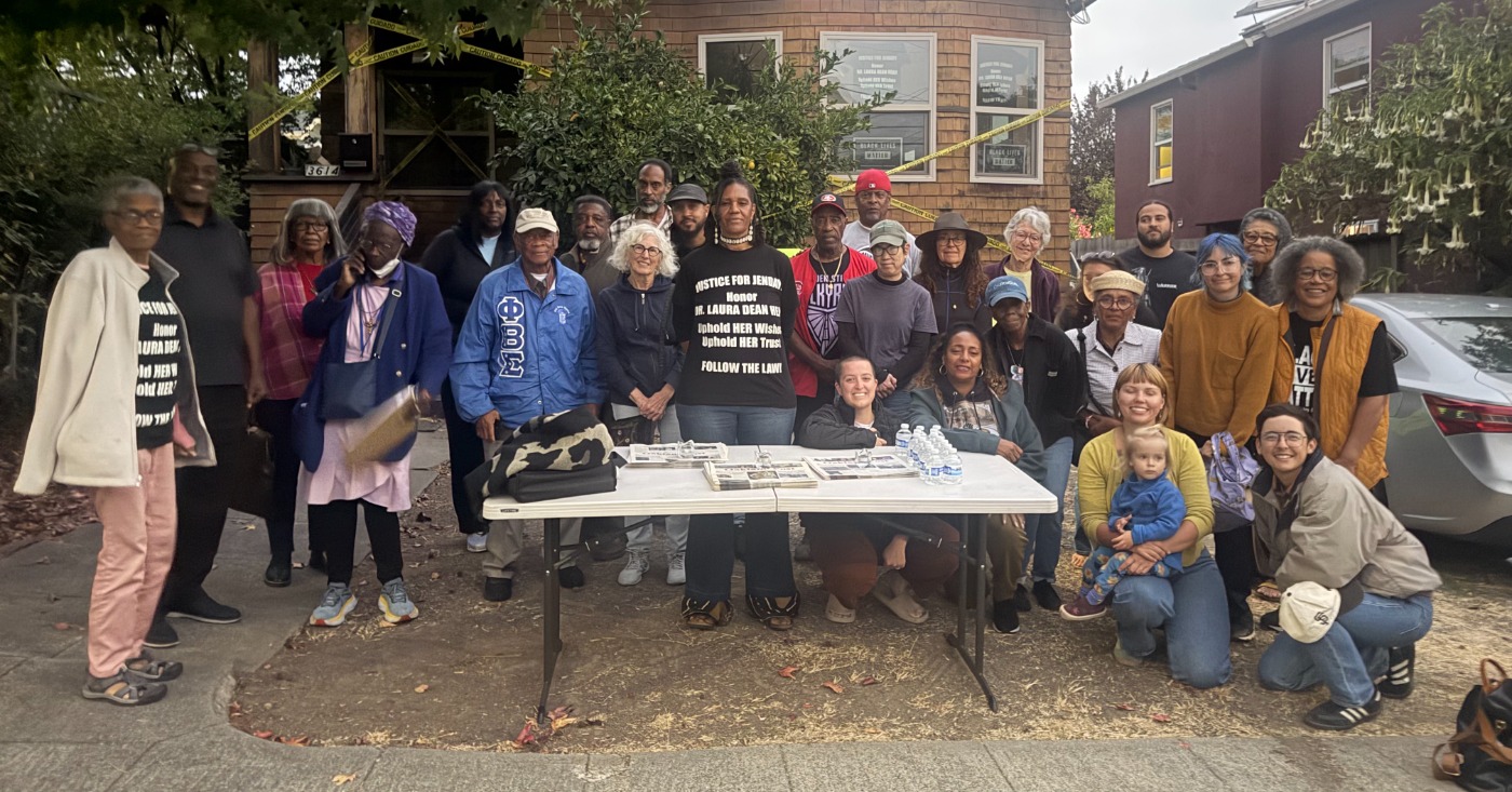 Zakiya Jendayi, center, surrounded by supporters at the weekly gathering at her house to halt her eviction. Photo by Tanya Dennis.