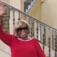 Standing by her birthday cake, Nuna McKee waves to family and friends who came from far and near to celebrate her birthday. Courtesy photo.