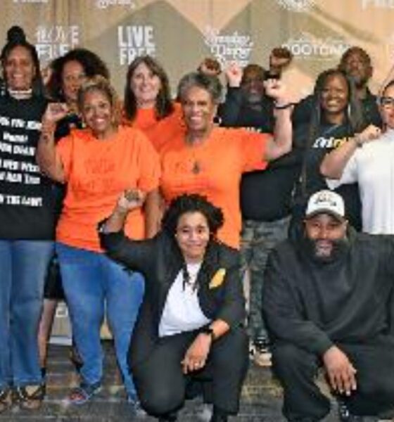 Imani Social Justice Team (left to right): Angela Noel, Zakiya Jendayi and Diane Doss. Patty Hallm, Susan Burns, Diane Lewis, Pastor Michael McBride, Theresa ???, Jean Moses and Diana Bell. Front: Sloane Johnson and (man whose name I'm getting to complete the identification). Photo by Octavian Kelly.