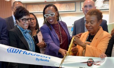 Oakland Mayor Barbara Lee cuts the ribbon at the official opening of Trader Vic’s Outpost and Plum Market at Oakland International Airport. She is assisted by U.S. Rep. Lateefah Simon as Port of Oakland Board President Stephanie Dominguez Walton, left, and representatives from Trader Vic's, Plum Market, look on. Photo courtesy of the mayor’s office.