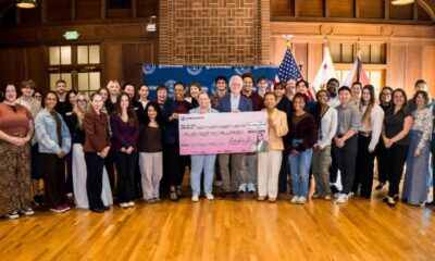 Flanked by students, holding the check to the college are (l.-r.) U.S. Rep Lateefah Simon, Renee Jadushlever and Dan Sachs of MCNUO and Oakland Mayor Barbara Lee. Courtesy photo.