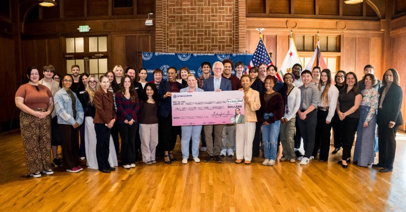 Flanked by students, holding the check to the college are (l.-r.) U.S. Rep Lateefah Simon, Renee Jadushlever and Dan Sachs of MCNUO and Oakland Mayor Barbara Lee. Courtesy photo.